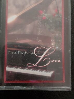 Vintage cassette tape titled "Roger Williams Plays The Songs Of Love
